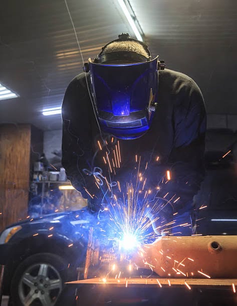 Automotive welding work being carried out in the workshop